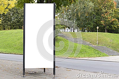 Mock up. Blank billboard outdoors, outdoor advertising, public information board near city park. Stock Photo