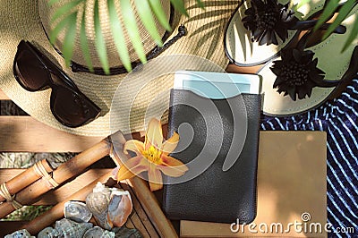 Mock up with electronic book, sunglasses and hat - outdoor summer touristic concept Stock Photo