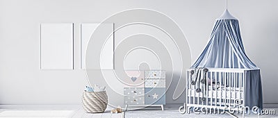 Mock up frame for bright nursery bedroom with white crib and rattan basket Stock Photo