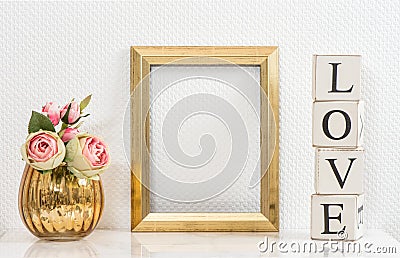 Mock up with golden frame and flowers. Love concept Stock Photo