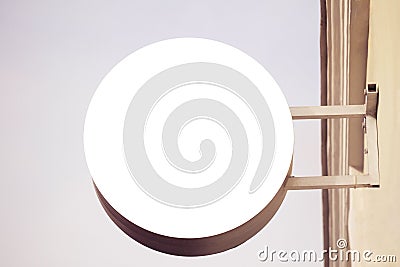 Mock up. Horizontal front view of empty round signage on the wall Stock Photo