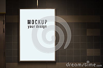 Mock up of light box in a city on the wall for your advertising. Blank mock up of vertical street poster billboard for your text Stock Photo