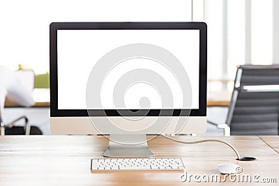 Mock up monitor computer screen with keyboard on office desk Stock Photo