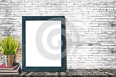 Mock up poster or photo frame with books and houseplant Stock Photo