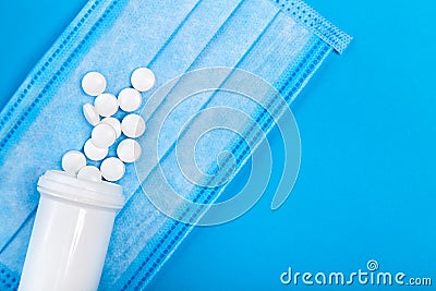 Mock up sick mask with a bottle of a medical product. Stock Photo