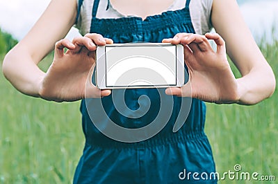 Mock up of a smartphone in the hands of a girl Stock Photo