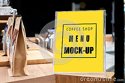 Mock up vertical signboard with acrylic frame in coffee shop Stock Photo