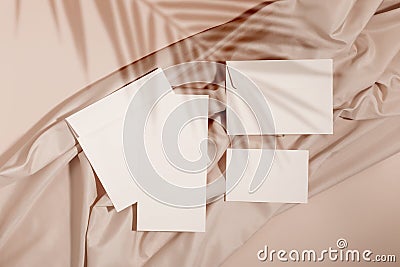 Mockup of blank cards and envelopes over neutral beige background Stock Photo