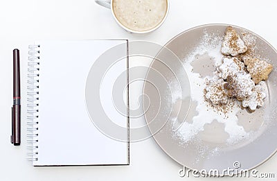 Mockup with blank notepad, cup of coffee and biscuit. New year cookies and cappuccino. Christmas morning still life. Stock Photo