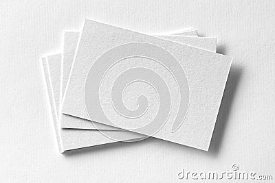 Mockup of business cards fan stack at white textured paper Stock Photo