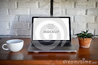 Mockup of business man using laptop screen for your advertising text message Laptop with blank screen on table compute work Stock Photo