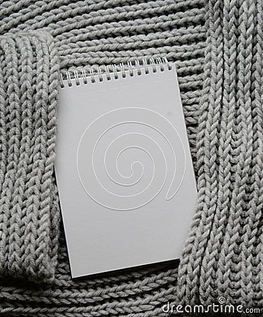 Mockup of cards at white textured watercolor paper background. Top view of spiral notebook Abstract knitting fabric Stock Photo