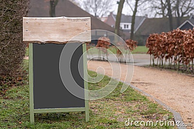 Mockup of a chalkboard sign with some wood on top Stock Photo