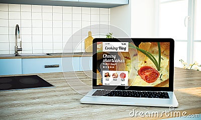 mockup of cooking blog screen laptop on island at kitchen Stock Photo