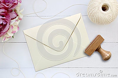 Mockup of envelope with a rubber stamp next to it. Stock Photo