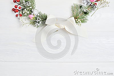 Mockup Half of Christmas Wreath Decorated with Red Berries. Flat lay on a white wooden background, with place for your text. Top v Stock Photo