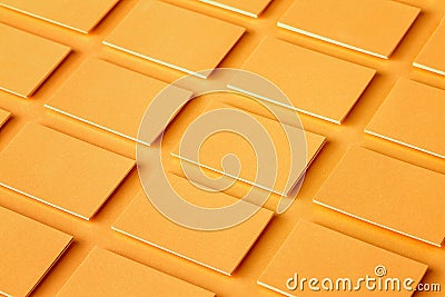 Mockup of horizontal golden business cards stacks at textured paper background. Stock Photo