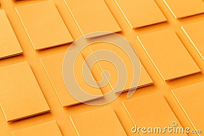 Mockup of horizontal golden business cards stacks at textured paper background. Stock Photo