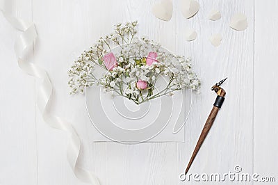 Mockup Letter with flowers and calligraphic pen greeting card for St. Valentine`s Day in rustic style with place for Stock Photo
