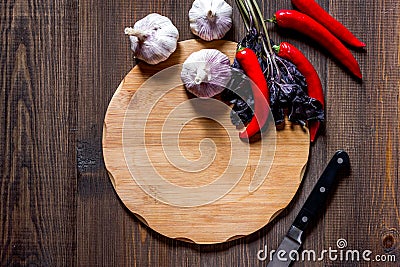 Mockup for menu. Cutting board and vegetables on wooden table background top view copyspace Stock Photo