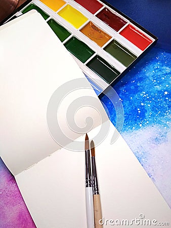 Mockup notebook paper watercolor paint palette paintbrush space photo Stock Photo