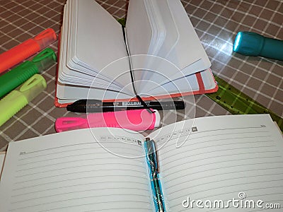 Mockup notepad, diary with pen, pencil, markers and a flashlight Stock Photo