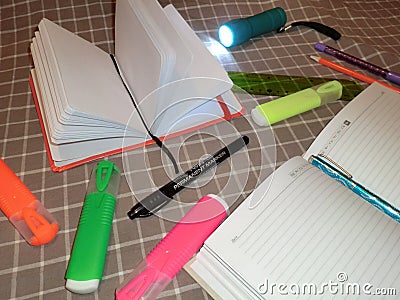 Mockup notepad, diary with pen, pencil, ruler, markers and a flashlight Stock Photo