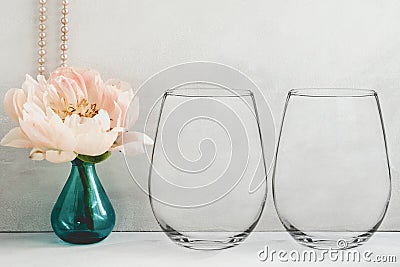 Mockup - stemless wine glasses, peony in a vase Stock Photo