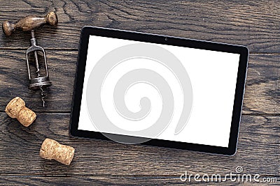 Mockup with tablet and vintage corkscrew on oak wooden table Stock Photo