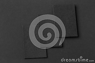 Mockup of three vertical business cards at black textured background. Stock Photo