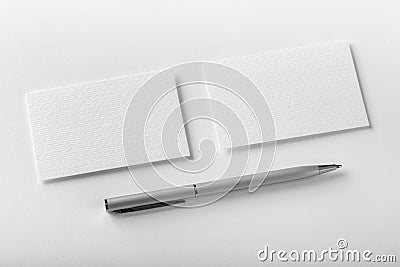 Mockup of two horizontal business cards and pen at white texture Stock Photo