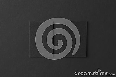 Mockup of two vertical business cards at black textured paper ba Stock Photo