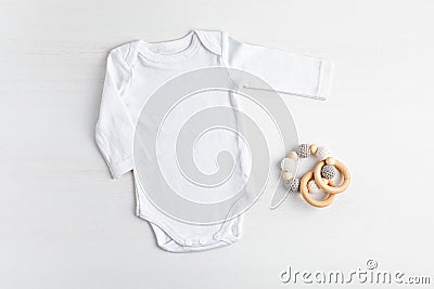 Mockup of white infant bodysuit made of organic cotton with eco friendly baby accessories Stock Photo
