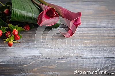 Mockup wooden background with purple calla lilly Stock Photo