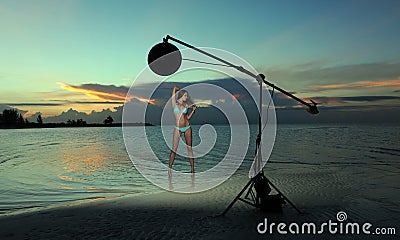 Model in bikini with coral necklace posing on the empty beach Stock Photo