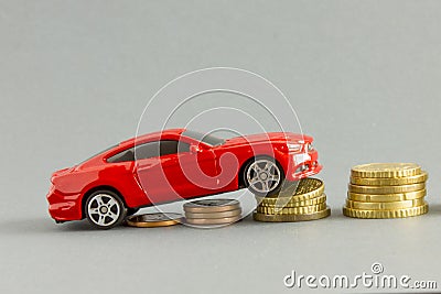 Model of car on background of coins, concept of car loan, car insurance Stock Photo