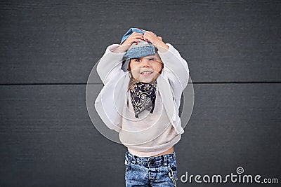 Model child hip-hop.baby in a baseball cap. Stock Photo