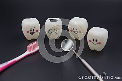 Model Cute toys teeth in dentistry on a black background Stock Photo