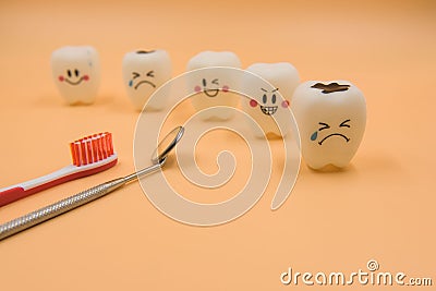Model Cute toys teeth in dentistry on a yellow background Stock Photo