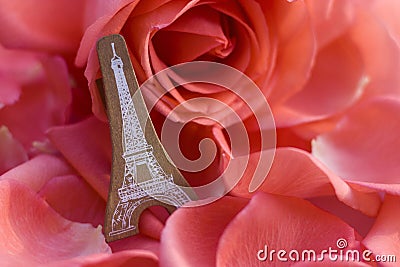 A model Eiffel lean against a rose Stock Photo