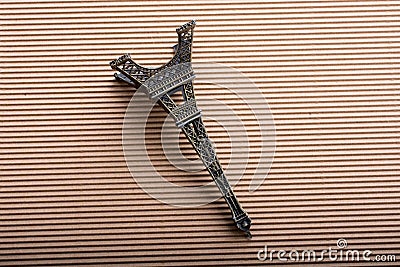 model Eiffel tower is on cardboard Stock Photo