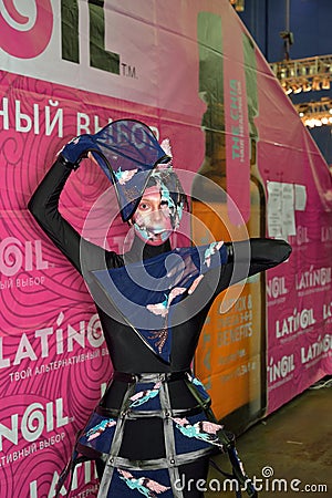 Model in an extravagant black suit in the photo zones at the festival of beauty Nevskie Berega in St. Petersburg Editorial Stock Photo