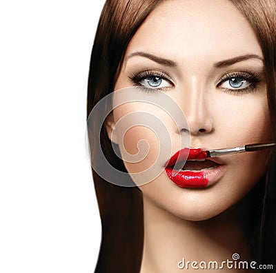 Model girl applying red lipgloss Stock Photo