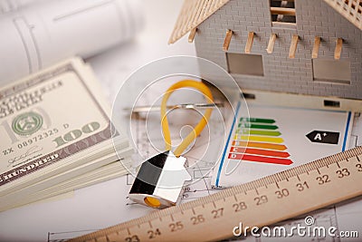 A model home and house key on architectural floor plans Stock Photo