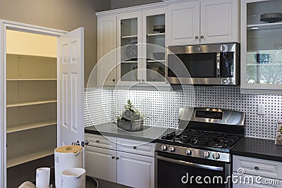 Model home kitchen and pantry. Stock Photo