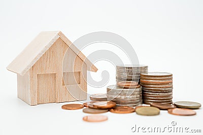 Model house, coins stack on white background for money saving concept Stock Photo