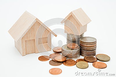 Model house, coins stack on white background for money saving concept Stock Photo