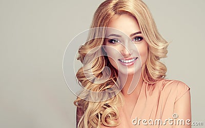 Model with long, dense, hairstyle and white toothy smile. Stock Photo