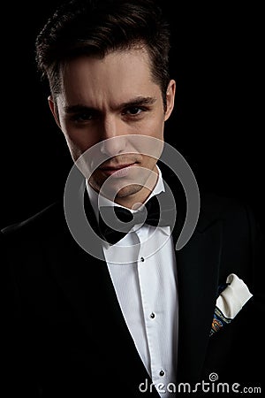 Model man in black tuxedo arousing with his look Stock Photo