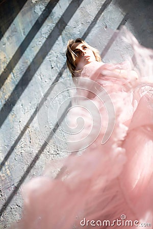 Model in a pink evening dress. Stock Photo